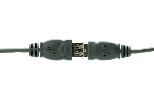 USB plugs connected isolated on a white background