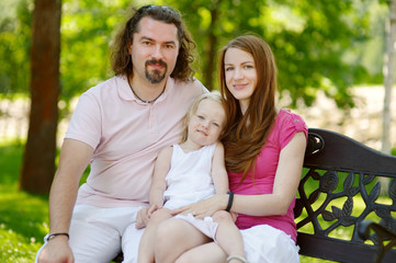 Happy young family of three