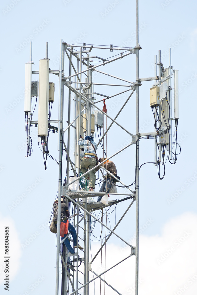 Wall mural technician working on communication towers