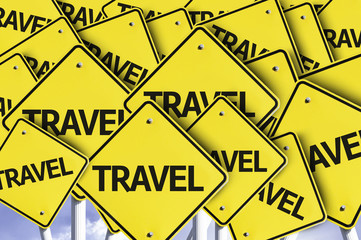 Travel written on multiple road sign