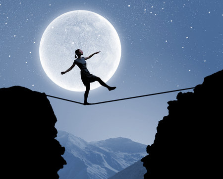 Woman walking on rope