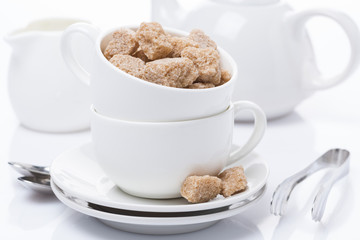 utensils for teatime and brown sugar, close-up