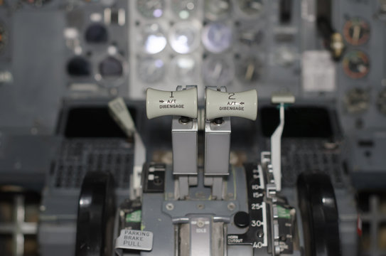 View of aircraft thrust lever in pilot's cabin.