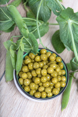 Boiled green peas, pods and branches