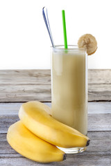 fresh banana smoothie on old rustic table