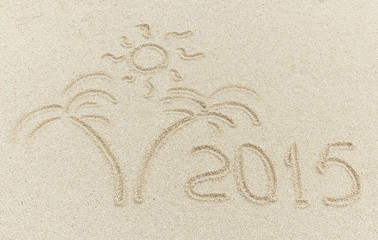 Fototapeta na wymiar new year 2015 message on the sand beach