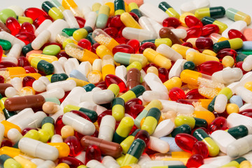 various pills and capsules as background