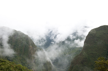 A view from Machu Picchu on a cloudy day.