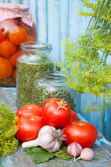 Homemade canned tomatoes in glass jar. Fresh vegetables and spic