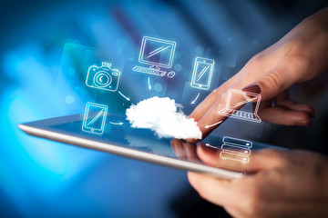 Finger pointing on tablet pc, mobile cloud concept