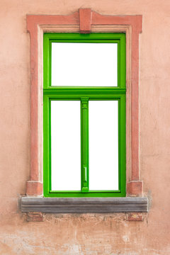 green window frame on old wall