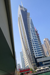 Dubai Marina with boat against skyscrapers in Dubai, UAE