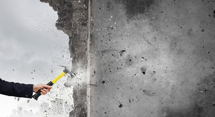Hand holding hammer