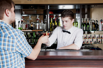 bartender gives the man ordered a cocktail