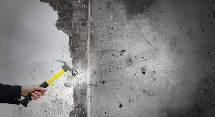 Hand holding hammer