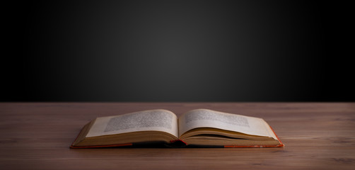 Open book on wooden deck