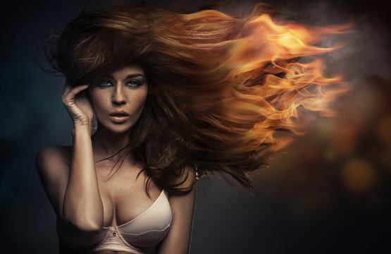 Art portrait of the woman with the flame hairstyle