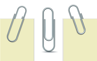 Metal paperclip and paper - obrazy, fototapety, plakaty