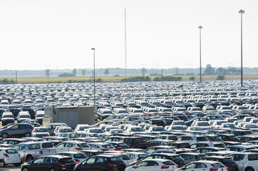 TUSCANY, ITALY - 27 June: New cars parked at distribution center