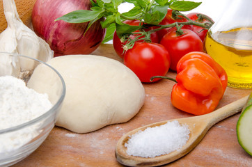Different ingredients to make a pizza