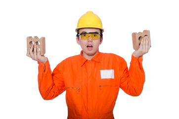 Man with brick isolated on white