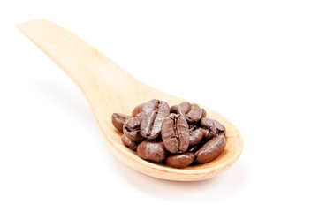 Wooden spoon with coffee beans  isolated on white background.