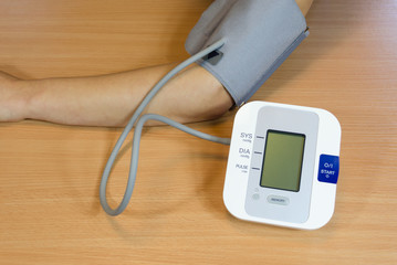 female patient check measure her blood pressure