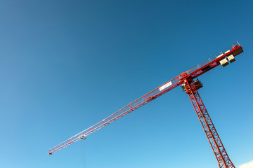 Construction crane on bright summer day