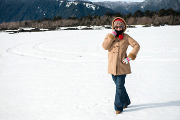 Fototapeta na wymiar Young beautiful woman in the snow