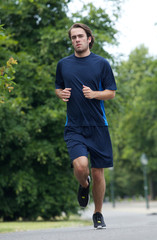 Fototapeta premium Young man running outdoors