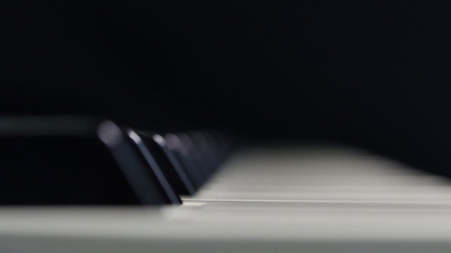 Piano keyboard with selective focus. Dolly Shot