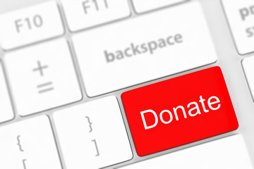 Fototapeta premium donate key word on computer keyboard,