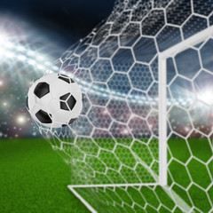 soccer ball in goal net