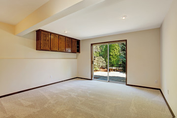 Empty room with slide door to backyard