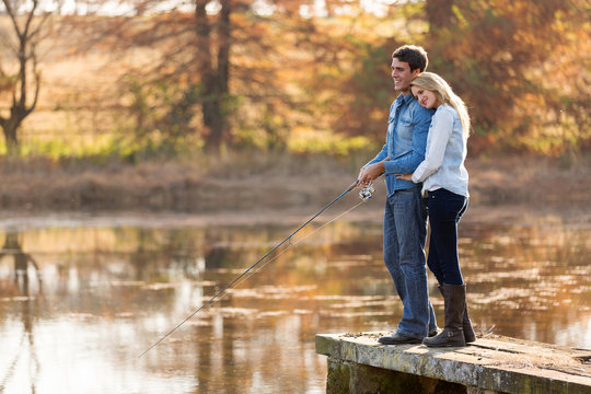 young couple fishing together