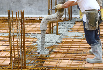Workers pouring concrete with motion blur © peuceta