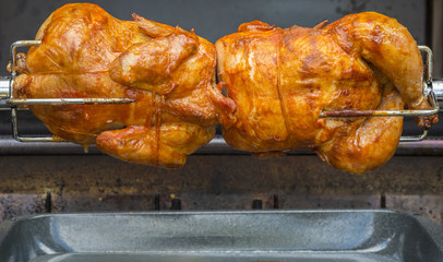 Rotisserie Chicken Over a Barbecue