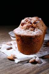 Tasty cake on table on black background