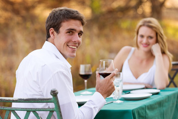 young man having romantic dinner with girlfriend