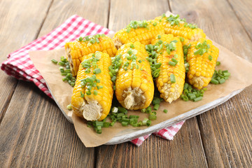 Grilled corn cobs on table, close-up