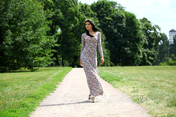 Beautiful young woman in colorful dress