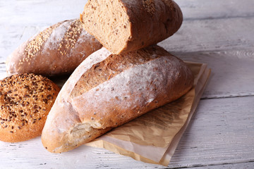 Fresh baked bread, on wooden background