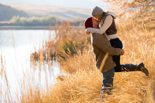 young couple kissing in autumn