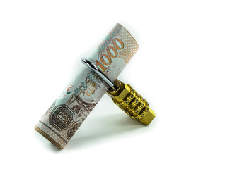 Padlock with thai banknote.
