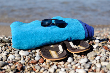 Flip flops on a sandy ocean beach