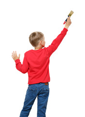 Little boy with paintbrush on wall, back view