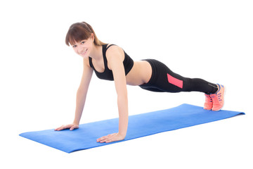 young woman doing push up exercise isolated on white