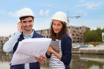 Architect woman and construction site supervisor