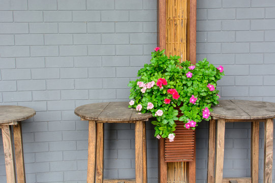 old vintage wooden table and wall with flower