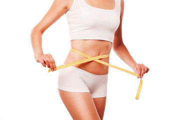 Woman measuring perfect shape. Healthy lifestyles concept. on